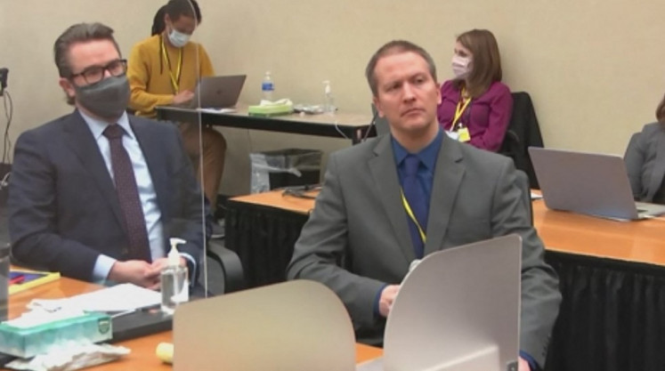 This screenshot obtained from video feed via Court TV on April 15, 2021, shows former Minneapolis police officer Derek Chauvin(R), who is accused of killing George Floyd, addressing the court on April 15, 2021, telling the presiding judge that he has decided not to testify in his own defense,