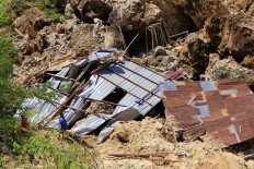 Residents look for their belongings in the ruins of their house that has been destroyed by a landslide in Oebufu subdistrict, Oebobo district, Kupang, East Nusa Tenggara on April 17, 2021. Hundreds of people were killed after flash floods and landslides triggered by Tropical Cyclone Seroja swept through East Nusa Tenggara on April 5.