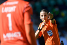 French referee Stephanie Frappart gestures during the French L1 football match between FC Nantes and OGC Nice at the La Beaujoire Stadium in Nantes, western France, on April 4, 2021.