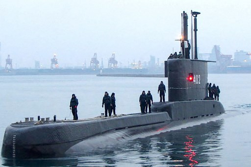 Indonesian Navy personnel prepare KRI Nanggala 402 for docking at a naval base in Surabaya, East Java, in this undated handout photo released on April 21, 2021, after the military lost contact with the Cakra-class submarine and its 53-strong crew during naval exercises off the coast of Bali.