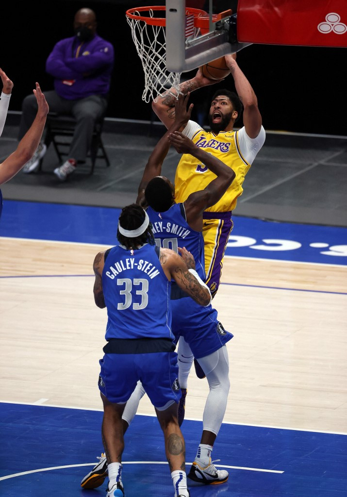 Anthony Davis #3 of the Los Angeles Lakers takes a shot against Dorian Finney-Smith #10 of the Dallas Mavericks in the second quarter at American Airlines Center on April 22, 2021 in Dallas, Texas.