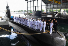 This handout from the Indonesia military taken on February 20, 2019 and released on April 21, 2021 shows the crew and officers during a ceremony onboard the Indonesian Cakra class submarine KRI Nanggala 402 at the naval base in Surabaya. Indonesia's military said it was searching for the submarine with 53 crew aboard after losing contact with the vessel during naval exercises off the coast of Bali on April 21, 2021.