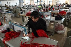This photo taken on March 25, 2021 shows a worker sewing at a lingerie factory in Guanyun county, some 50 kilometres from Lianyungang in China's northeastern Jiangsu province. Americans like their lingerie to be risque, Europeans prefer it more classy, and Chinese remain a bit shy but are opening up. But the biggest order of all came from North Korea.