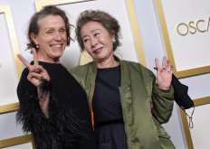 Frances McDormand (left), winner of the award for best actress in a leading role for "Nomadland," and Yuh-Jung Youn, winner of the award for best actress in a supporting role for "Minari," pose in the press room at the Oscars on April 25, 2021, at Union Station in Los Angeles.
