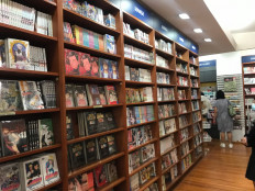 Shelves full of Japanese manga comics in Kinokuniya Plaza Senayan. 