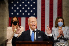 President Joe Biden addresses a joint session of Congress, with Vice President Kamala Harris and House Speaker Nancy Pelosi (D-CA) on the dais behind him on April 28, 2021 in Washington, DC. 
