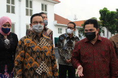 Jakarta Governor Anies Baswedan (front left) and State-Owned Enterprises Minister Erick Thohir (front right) during an HoA signing ceremony at Fatahillah Square in Jakarta on Wednesday. The HoA marked the start of the establishment of a new state JV to manage Kota Tua.