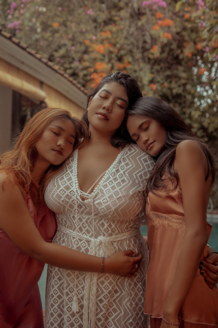 Diverse models appear in a commercial photograph for Nipplets, a local lingerie and sleepwear brand that caters to women of all shapes and sizes.