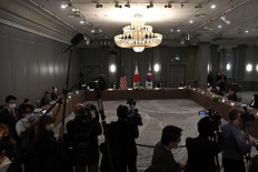 (left-right) Japan's Foreign Minister Toshimitsu Motegi, US Secretary of State Antony Blinken and South Korea's foreign minister Chung Eui-yong take part in a trilateral meeting on the sidelines of the G7 foreign ministers meeting in London on May 5, 2021. G7 foreign ministers meet in London for their first face-to-face talks in more than two years, with calls for urgent joined-up action to tackle the most pressing global threats.