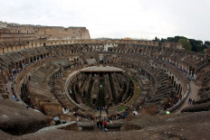 An aerial view of Rome's ancient Colosseum in Italy shows the 2,000-year old structure is floorless. The ruins of the underground levels' walls and tunnels exposed to the open air save for a small platform.