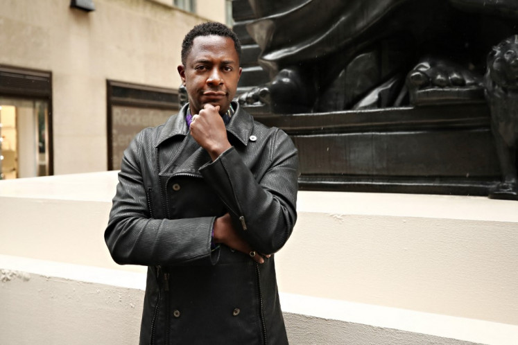Sanford Biggers poses for a photo at Rockefeller Center on May 05, 2021 in New York City. Black artists are represented like never before at New York's spring sales next week after years of being overlooked and underappreciated, with several expected to set new records for their works. 