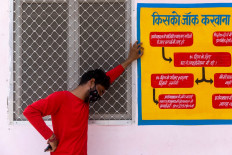 As Indonesia tries to help India, officials warn people not to lower guard against virus