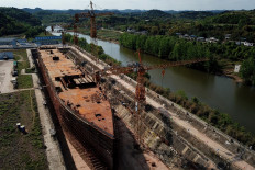 This aerial photo taken on April 26, 2021 shows a still-under-construction replica of the Titanic ship in Daying County in China's southwest Sichuan province. The ill-fated Titanic which sank over a hundred years ago is being resurrected as the centrepiece of a theme park in southwest China, where tourists can splash out for a night on the true-to-size vessel.