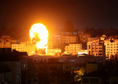 Fire and smoke rise above buildings in Gaza City as Israeli warplanes target the Palestinian enclave, early on May 17, 2021. Israeli warplanes bombarded the Gaza Strip overnight, said witnesses in the Palestinian enclave, from where armed groups have launched rockets into the Jewish state.