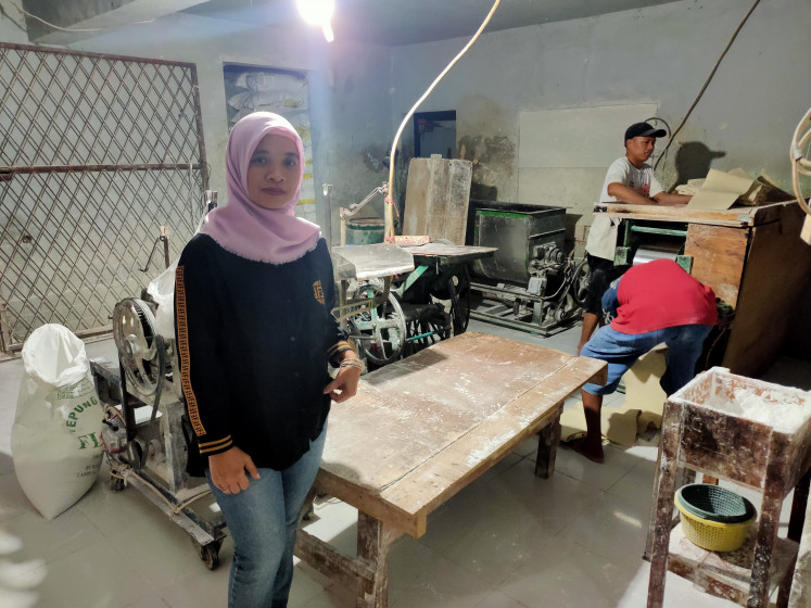 Noodle legacy: Ratiman's daughter, Tri Murtini (50) in the noodle factory located in her house in Tambora, has continued her father's business.