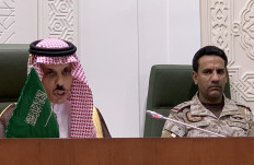 Saudi Foreign Minister Faisal bin Farhan (left) speaks during a press conference in the capital Riyadh on March 22, 2021, announcing an offer of a ceasefire with Yemen's Huthi rebels. Saudi Arabia offered Yemen's Huthi rebels a 