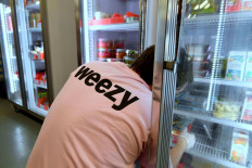 A picker from online supermarket Weezy prepares an order at the Lambeth depot, amidst the expansion of rapid grocery delivery firms, London, Britain.