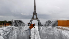 An art installation has created an optical illusion that Eiffel Tower is perched on a ravine.