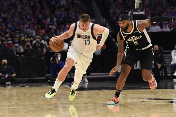 Luka Doncic #77 of the Dallas Mavericks handles the ball against the LA Clippers during Round 1, Game 1 of the the 2021 NBA Playoffs on May 22, 2021 at STAPLES Center in Los Angeles, California.