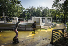 Children rollerblade at Puring Park in Kebayoran Baru, South Jakarta, on May 15. The Jakarta administration has opened several public parks in the capital at 30 percent of visitor capacity and under limited operating hours.