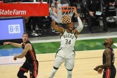  Giannis Antetokounmpo #34 of the Milwaukee Bucks dunks in the third quarter against the Miami Heat during Game Two of their Eastern Conference first-round playoff series between the Milwaukee Bucks and the Miami Heat at Fiserv Forum on May 24, 2021 in Milwaukee, Wisconsin.