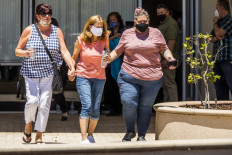People leave a gathering point for family members and VTA employees on May 26, 2021 in San Jose, California. A VTA employee opened fire at the yard, with preliminary reports indicating nine people dead including the gunman.