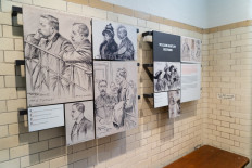 Court sketches are displayed in a cell during a press preview of the new Bow Street Police Museum at the former home of the original 'Bow Street Runners' in Covent Garden, central London on May 27, 2021.