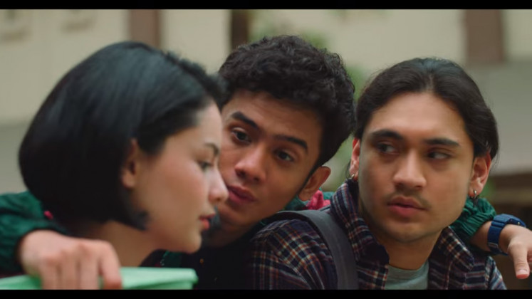 Love triangle: In Tersanjung: The Movie, Yura, portrayed by Clara Bernadeth (left), is caught in a love triangle with her two best friends, Oka, portrayed by Kevin Ardilova (center) and Christian, portrayed by Giorgino Abraham.