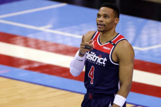 In this file photo taken on January 26, 2021 Russell Westbrook #4 of the Washington Wizards gestures to fans during the first quarter of a game against the Houston Rockets at Toyota Center in Houston, Texas. Three NBA teams said on May 27, 2021 that they had banned fans from their arenas for inappropriate behavior -- including a Philadelphia 76ers fan who dumped popcorn on Washington star Russell Westbrook.