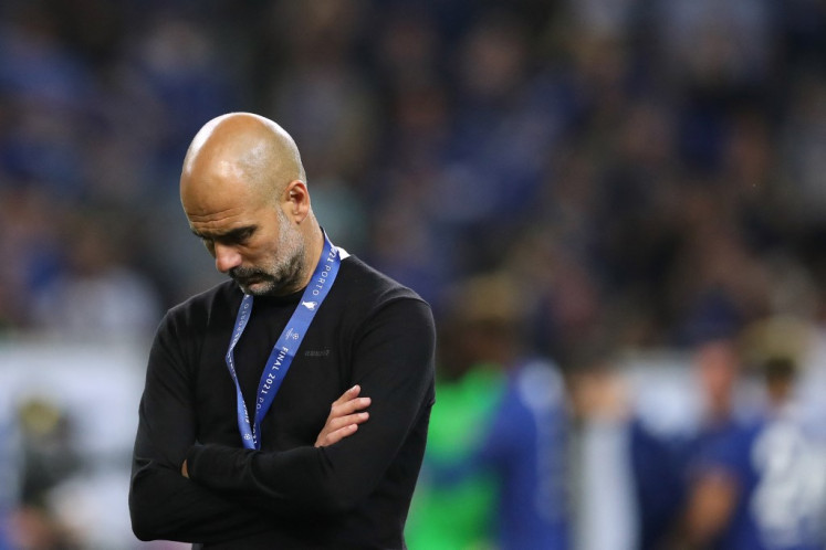 Manchester City's Spanish coach Josep Guardiola reacts at the end of the UEFA Champions League final football match between Manchester City and Chelsea FC at the Dragao stadium in Porto on May 29, 2021.