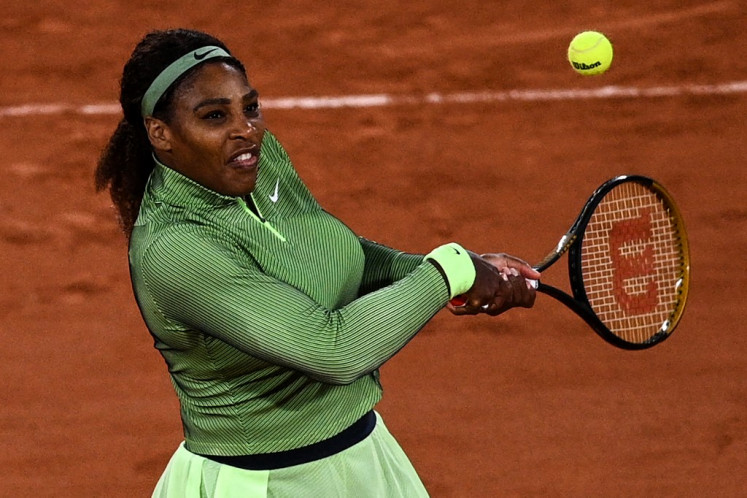 Serena Williams of the US returns the ball to Romania's Irina Begu during their women's singles first round tennis match at the court Philippe Chatrier on Day 2 of The Roland Garros 2021 French Open tennis tournament in Paris on May 31, 2021.