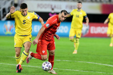  In this file photo taken on October 8, 2020 Macedonia's forward Goran Pandev (R) fights for the ball with Kosovo's midfielder Herolind Shala (L) during the UEFA Euro 2020 Playoff Semi-Final football match between North Macedonia and Kosovo at Todor Proevski Arena in Skopje.