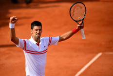 Serbia's Novak Djokovic celebrates after winning against Uruguay's Pablo Cuevas during their men's singles second round tennis match on Day 5 of The Roland Garros 2021 French Open tennis tournament in Paris on June 3, 2021.