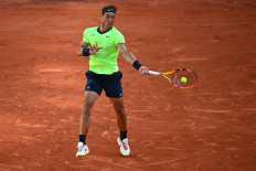 Blinded by the light as Nadal reaches 15th French Open quarter-final