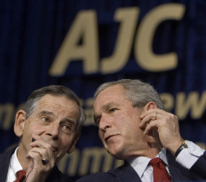 Robert Goodkind (L), President of the American Jewish Committee, and US President George W. Bush talk as they listen on their translation earpieces to Germany's Chancellor Angela Merkel at the American Jewish Committee's centennial dinner in Washington 04 May 2006 in Washington, DC. 