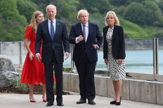 Britain's Prime Minister Boris Johnson (center) and his wife Carrie Johnson (right) walk with US President Joe Biden (left) and US First Lady Jill Biden at Carbis Bay, Cornwall on June 10, 2021, ahead of the three-day G7 summit being held from 11-13 June. G7 leaders from Canada, France, Germany, Italy, Japan, the UK and the United States meet this weekend for the first time in nearly two years, for the three-day talks in Carbis Bay, Cornwall.