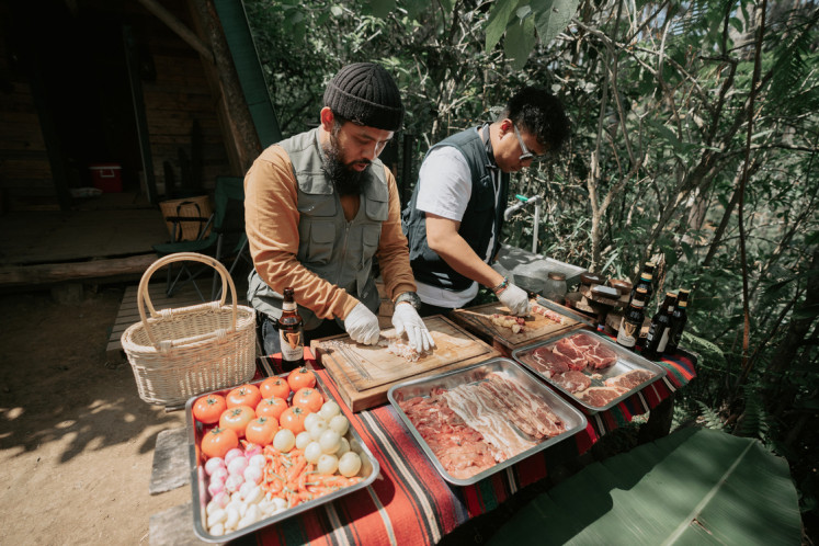 Mouth-watering: Gianjar and Hedi prepare their famous barbecue.