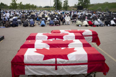Muslim victims of attack given farewell with coffins draped in Canadian flag