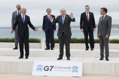 (left-right) President of the European Council Charles Michel, US President Joe Biden, Japan's Prime Minister Yoshihide Suga, Britain's Prime Minister Boris Johnson, Italy's Prime minister Mario Draghi and France's President Emmanuel Macron pose for the family photo at the start of the G7 summit in Carbis Bay, Cornwall on June 11, 2021. G7 leaders from Canada, France, Germany, Italy, Japan, the UK and the United States meet this weekend for the first time in nearly two years, for three-day talks in Carbis Bay, Cornwall.