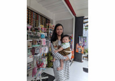 A new start: Stay-at-home mother Verra Febrina was three months pregnant when she was laid off from her factory job. She turned to Mitra Tokopedia, and since then her monthly transactions have increased tenfold.