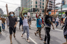No games: Protesters make the three-finger salute reminiscent of the ‘Hunger Games’ movies as they take part in a demonstration against military rule in Yangon, Myanmar, on June 13, 2021.