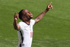 England's forward Raheem Sterling celebrates scoring his team's first goal during the UEFA EURO 2020 Group D football match between England and Croatia at Wembley Stadium in London on June 13, 2021.
