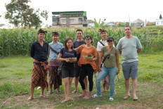 At home in Bali: Chef Dean Keddell (far right) with staff member Ayu (second from right) and their acquaintances. 