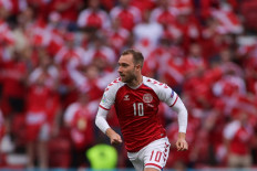 Denmark's midfielder Christian Eriksen runs during the UEFA EURO 2020 Group B football match between Denmark and Finland at the Parken Stadium in Copenhagen on June 12, 2021.
