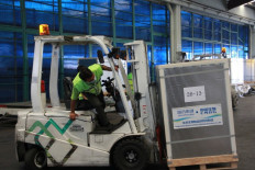 New blood: A worker transported boxes containing Sinopharm vaccines that have just been arrived on Friday. The government has received an additional 1 million doses of Sinopharm vaccines, adding up to 2 million of Sinopharm vaccines in total. The Sinopharm vaccines are being tailored for the Gotong Royong scheme, which allows companies to buy the vaccines and use it for their employees in order to boost the number of vaccinated productive people.