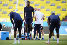 France's midfielder Paul Pogba (C) jumps during an MD-1 training session at the Allianz Arena in Munich on June 14, 2021, on the eve of their UEFA EURO 2020 football match against Germany.