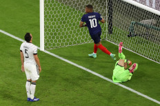 Germany's defender Mats Hummels (L) reacts after deflecting the ball into his own net during the UEFA EURO 2020 Group F football match between France and Germany at the Allianz Arena in Munich on June 15, 2021.