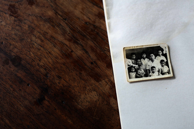 Barber family: Edi's family photo with his seven brothers and their parents. Four of them worked as barbers.