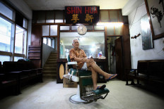 The passion and struggles of Shin Hua, Surabaya's oldest barbershop