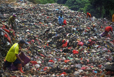 Waste pickers sift through garbage on May 20, 2021 at the Cilowong landfill in Serang, Banten, in search of saleable items. Though waste pickers play an important role in the circular economy, they are generally ignored and unprotected.